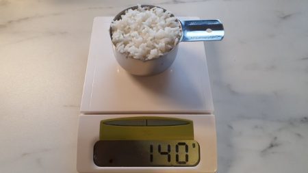 how many grams of sugar in 1 cup of rice cooked