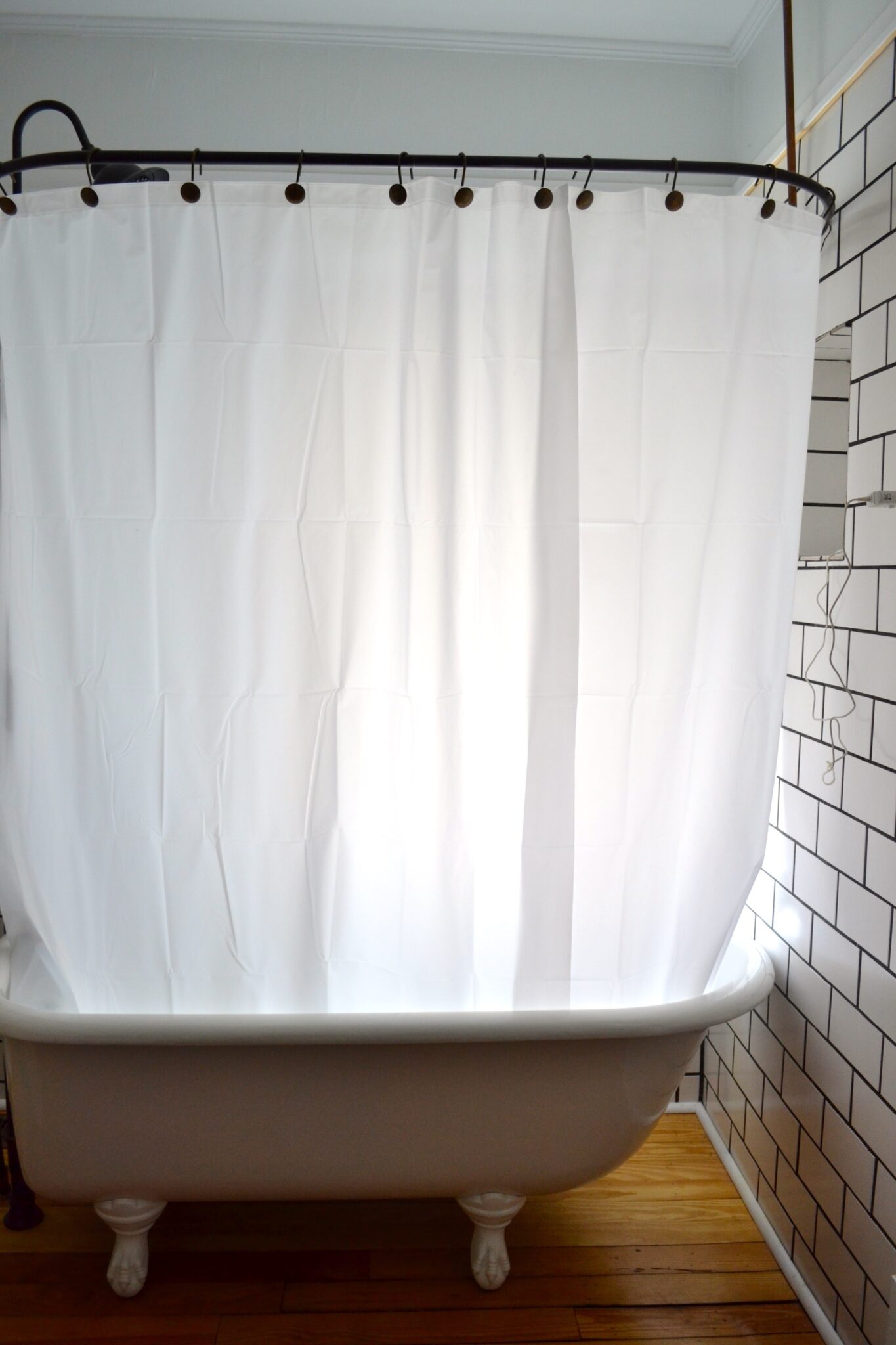 Should Shower Curtain Be Inside Tub